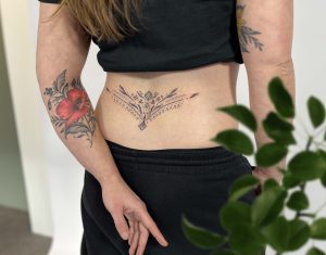 Lower back tattoo - dotwork - ornamental - 90s - tattoo - tatoeage - poppy - flowers - floral tattoo - aarsgewei - Breda